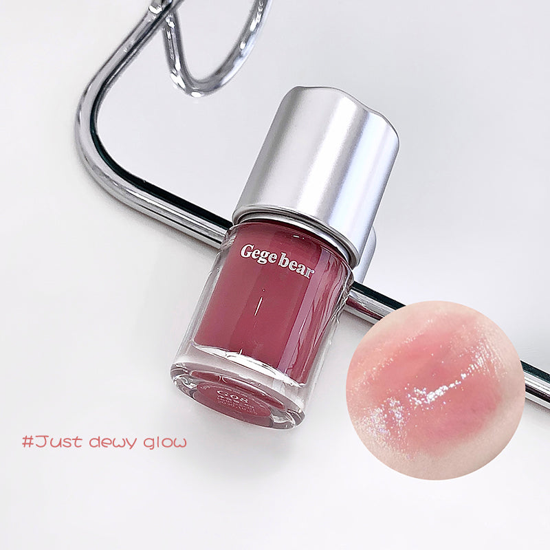 Nail polish bottle with a pink shade and 'Gegebear' branding, next to a pink lip balm on a white background.