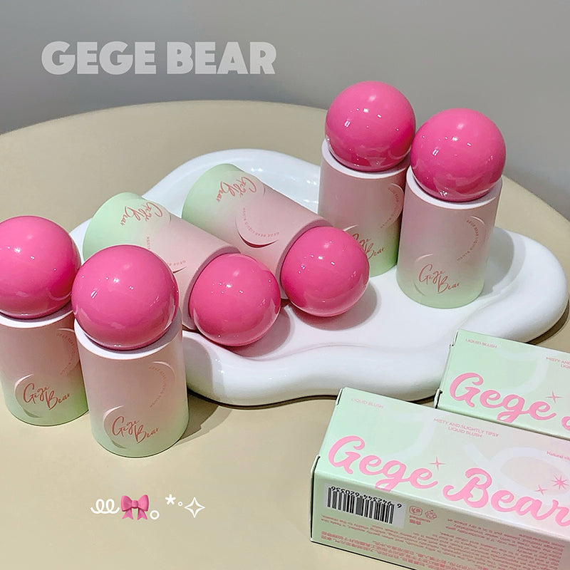 Pink and green cosmetic products with 'Gege Bear' branding on a beige surface.