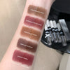 Lipstick swatches on a person's arm with labeled colors and a set of lipsticks in the background.