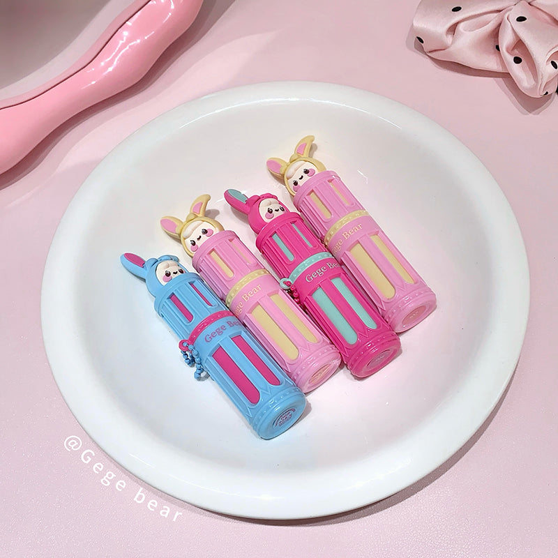 Four colorful pencil cases with cartoon character designs on a white plate against a pink background.
