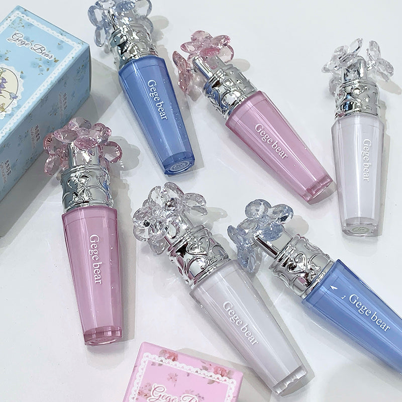 Set of Gege bear lip glosses in various colors on a white background