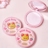 Compact powder with bear design on a pink background