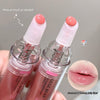 Two lip gloss products with a close-up of lips wearing the product, on a gray background.