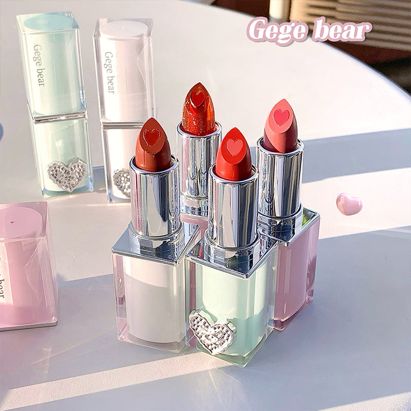 Set of lipsticks with heart designs in a clear case on a light background, featuring the brand 'Gego bear'.