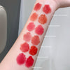 Lipstick swatches on a person's arm with color names labeled