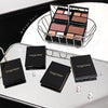 Makeup products with 'Gege bear' branding on a reflective surface.