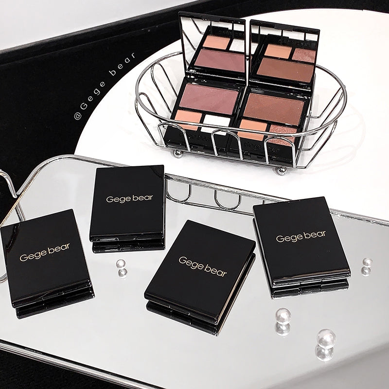 Makeup products with 'Gege bear' branding on a reflective surface.