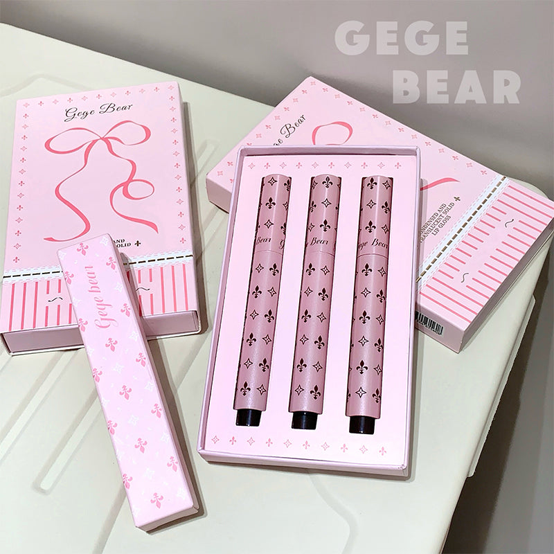 Set of pink nail art tools with 'GEGE BEAR' branding on a light surface.