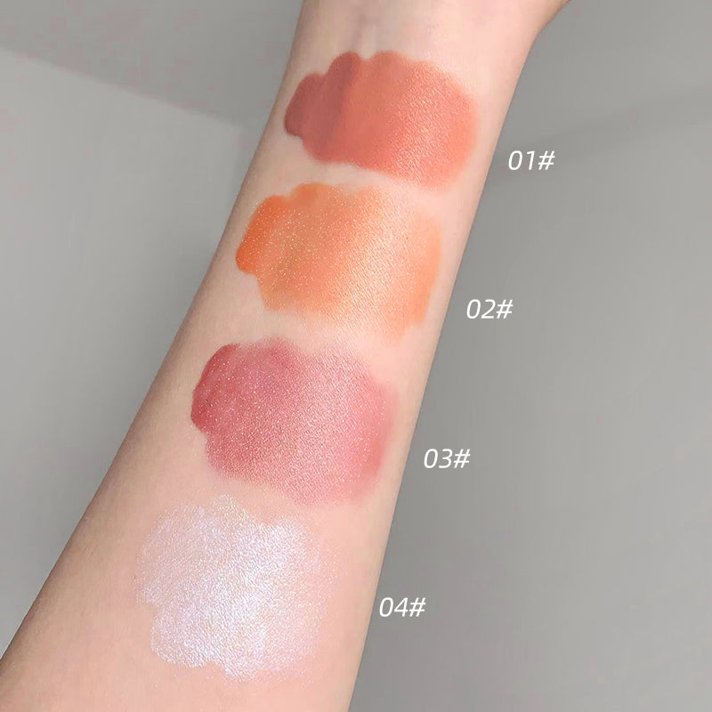 Four swatches of different lipstick colors on a person's arm with labels.
