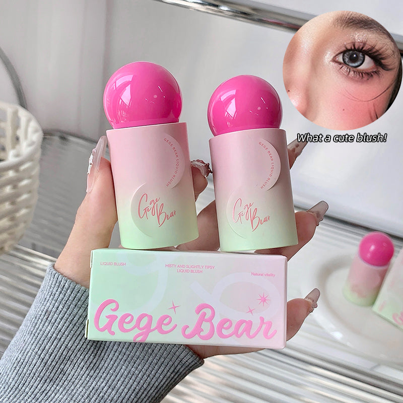 Two pink and green cosmetic products with 'Gege Bear' branding held by a person.
