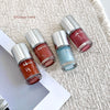 Four bottles of Gege bear nail polish on a textured surface