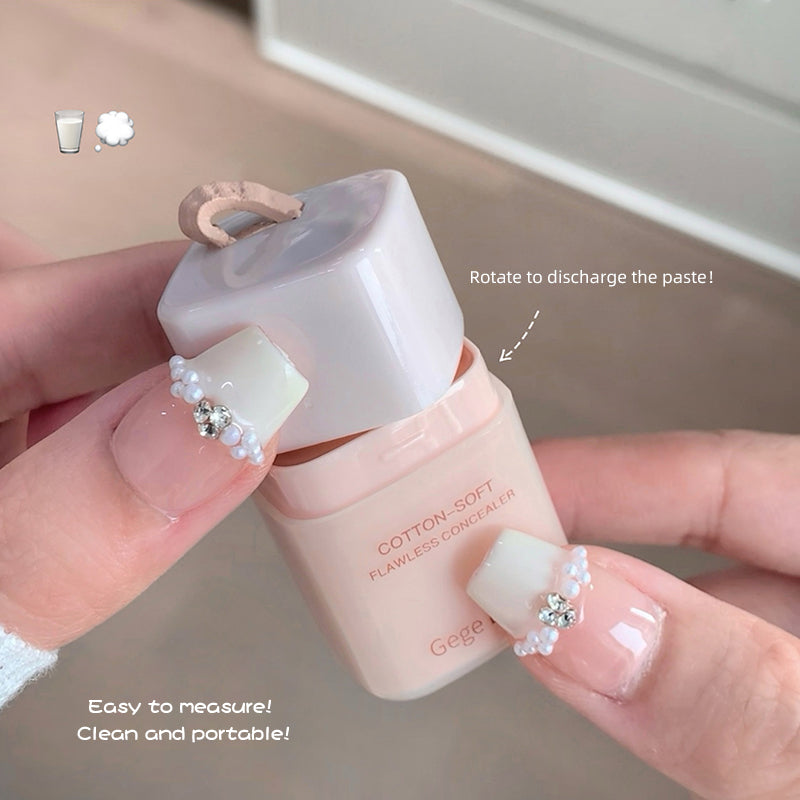 Hand holding a small pink and white container with text indicating features.