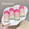 Five small bottles with pink caps on a white dish, branded 'GEGE BEAR'.