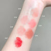 Color swatches of a lipstick on a person's arm with labeled shades.