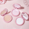 Four pink makeup compacts with different powders on a light pink background