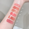 Lipstick swatches on a person's arm with color labels.