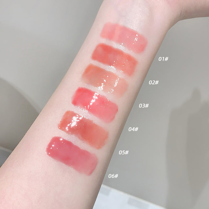 Lipstick swatches on a person's arm with color labels.