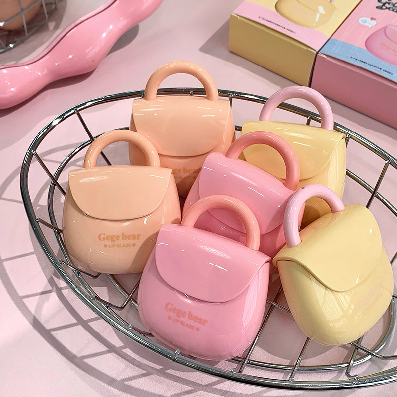Set of small handbags in pastel colors on a wire rack.