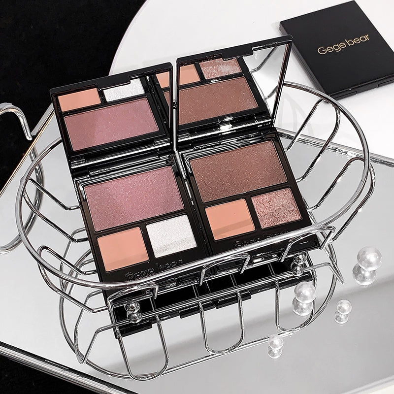 Makeup palettes with a Gegebear box on a reflective surface