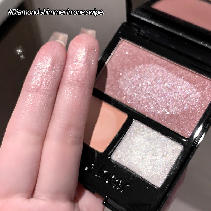 Makeup palette with glittery shades and a hand showing a swatch.