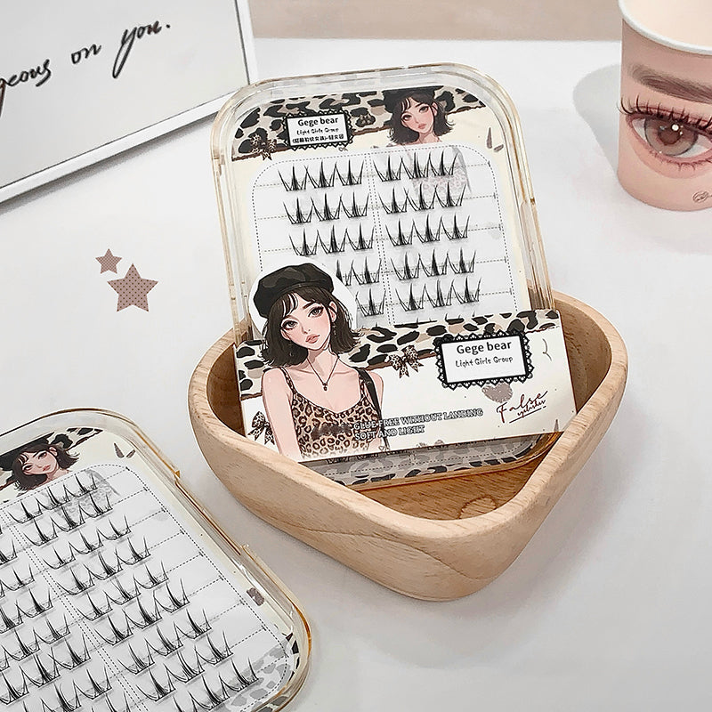 Eyelash packaging with illustrations on a white surface