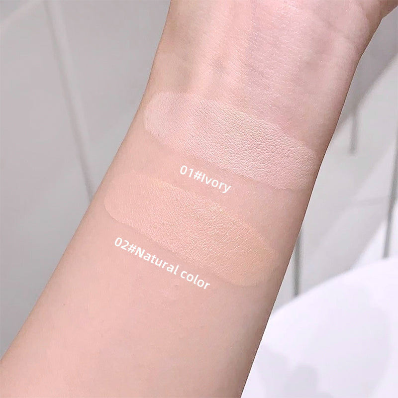 Two swatches of cream on a person's arm labeled '01#Ivory' and '02#Natural color'.