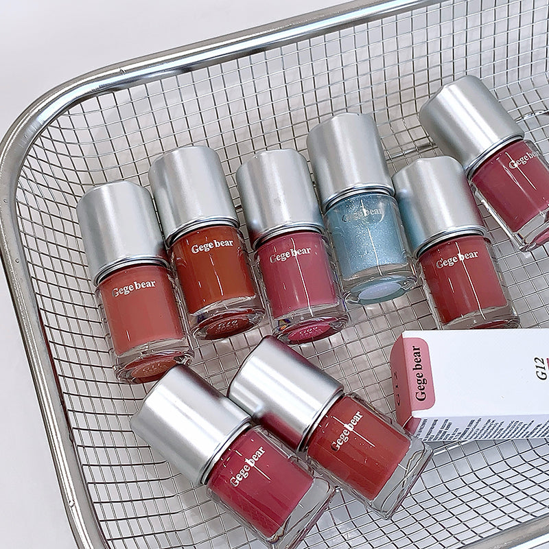 Gege bear nail polishes in various colors on a metal grid background