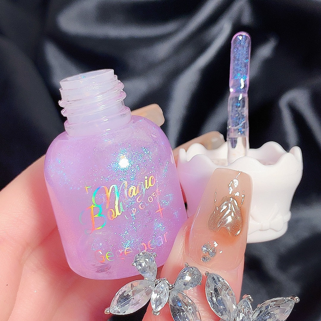 Purple nail polish bottle with decorative nails and crystals on a dark fabric background