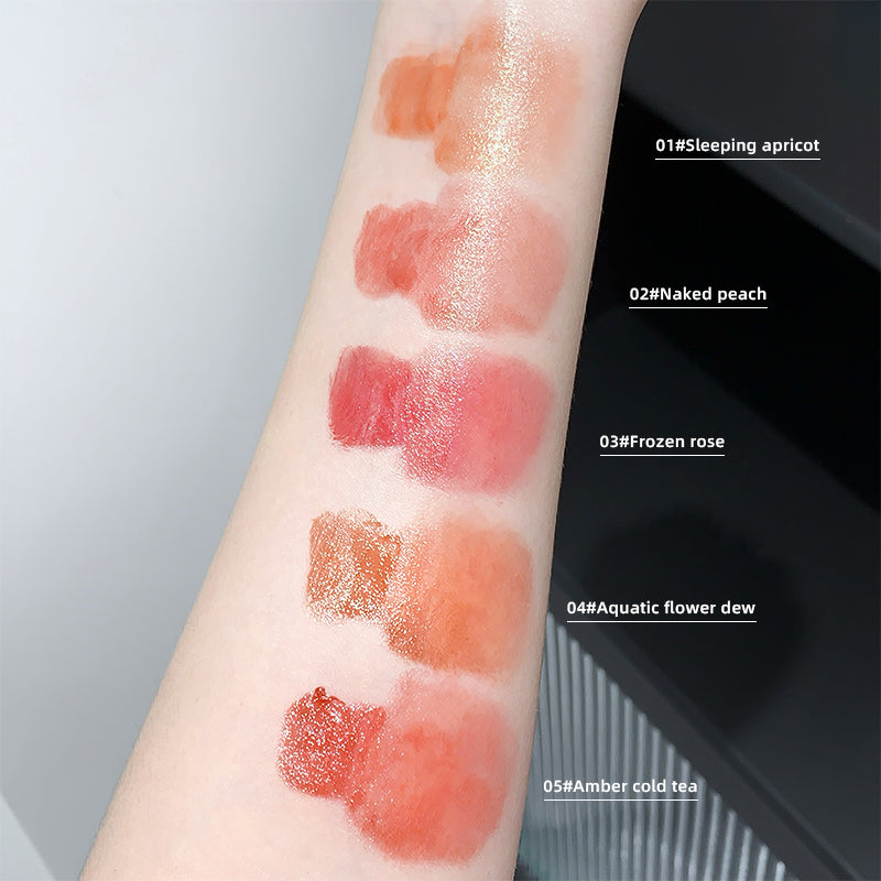 Lipstick swatches on a person's arm with labeled colors