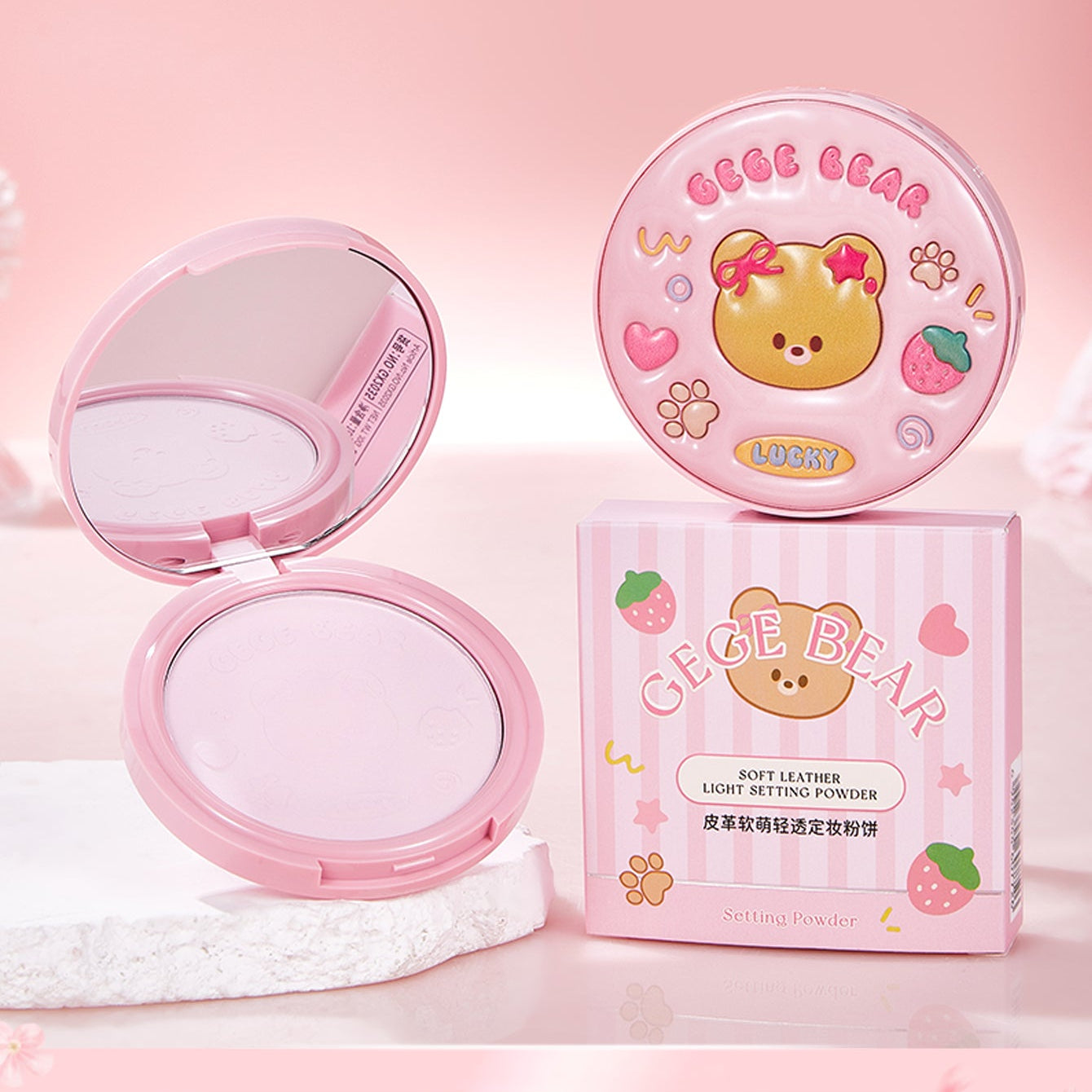 Pink makeup compact with bear design on a pink background