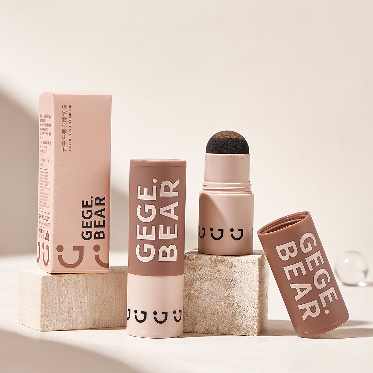 Makeup products with 'GEGE BEAR' branding on a neutral background