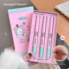 Pink lip cream set with packaging and close-up of cream on a wooden surface