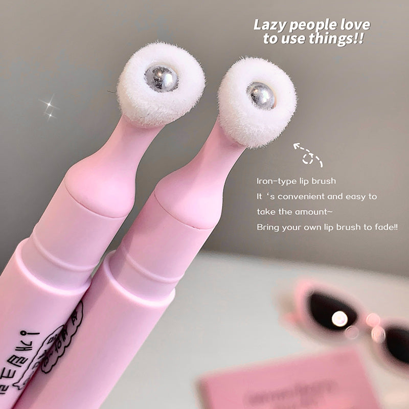 Pink lip brush with white bristle heads on a gray background, text indicating convenience.