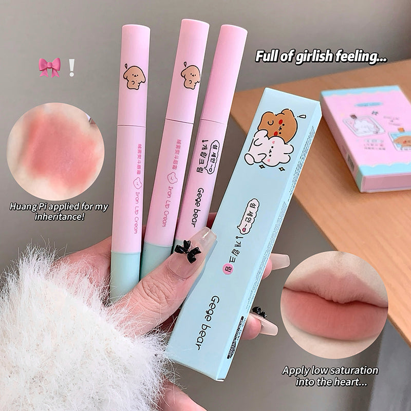 Three pink lip pencils with a blue case labeled 'Goober Bear' held by a hand, with close-up shots of the product and text on a neutral background.