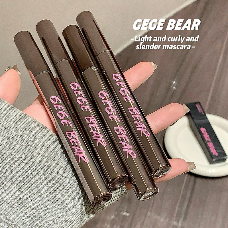 Five GEGE BEAR mascara tubes held in a hand with a blurred background