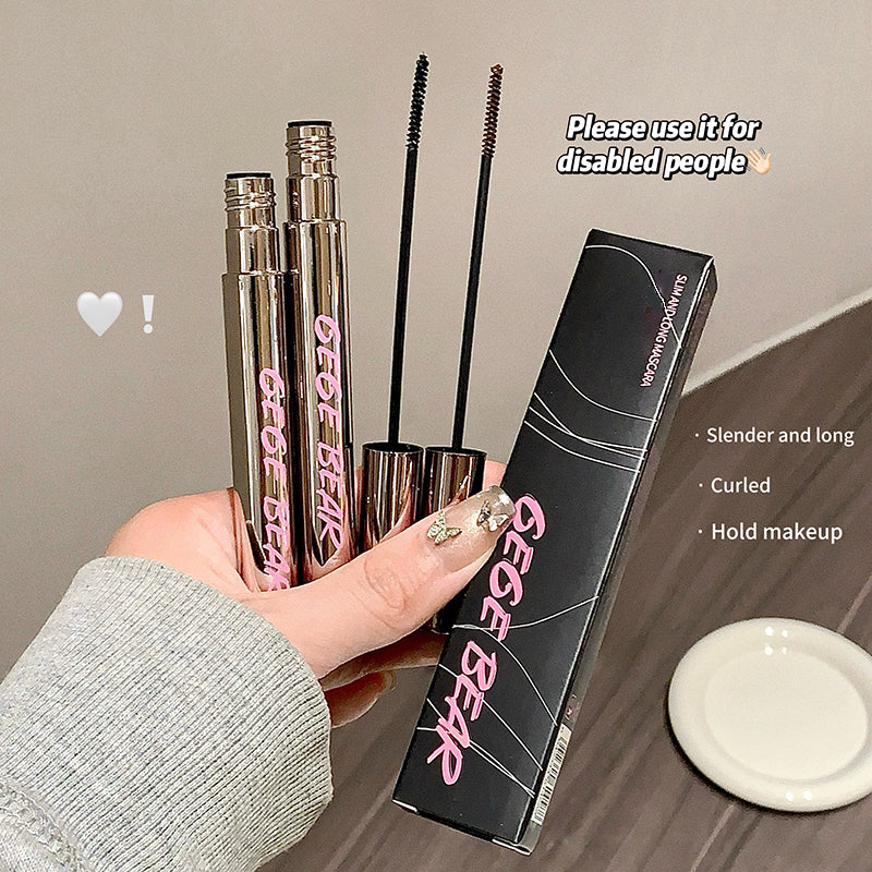 Eyelash products including mascara and eyeliner with packaging held by a hand on a neutral background.