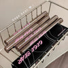 Three lipsticks with 'GEGE BEAR' branding on a metal rack.