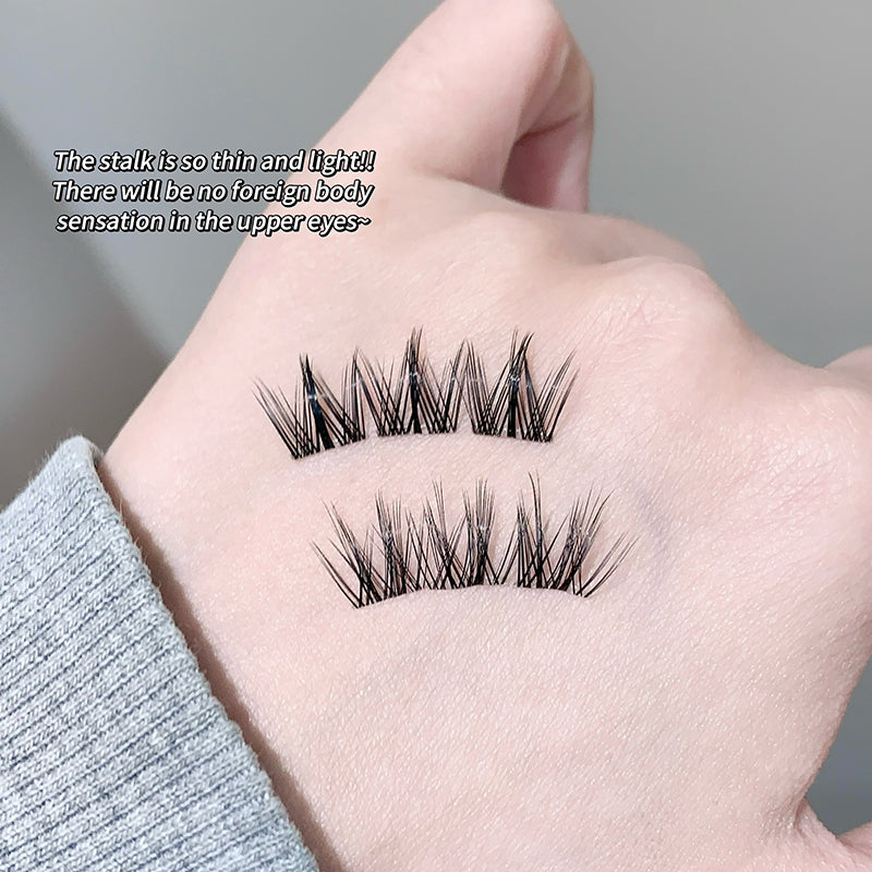 False eyelashes displayed on a hand with a neutral background