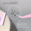Eyelash extension with tweezers and adhesive strip on a gray background