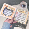 False eyelashes packaging with a hand holding it, showing close-up details.