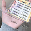 Cat elf style false eyelashes on a hand with packaging in the background