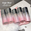 Five Gege Bear makeup products held in a hand with a soft background