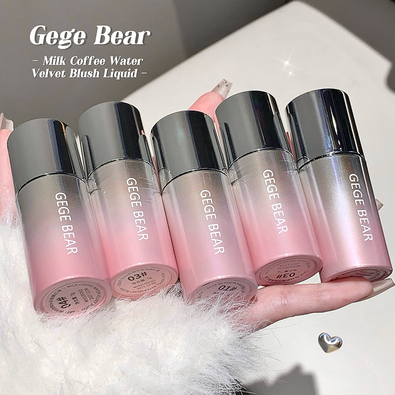 Five Gege Bear makeup products held in a hand with a soft background