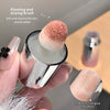 Makeup brush with pink bristle tip held by a hand, with text on plant and dyeing brush.