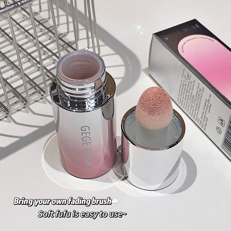 Makeup product with a brush on a white surface, featuring the brand 'GEGE BAR'.