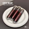 Three GEGE BEAR lip mud products on a white plate with a dark background