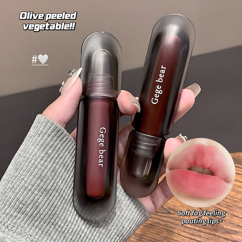 Two dark red lip glosses with 'Gege bear' branding held by a hand, with a close-up of lips wearing the gloss.