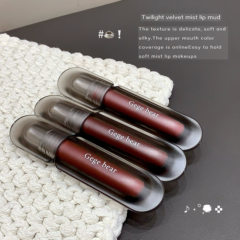 Three Gege bear lipsticks in a black case on a textured white surface with descriptive text.