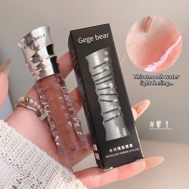 Lip gloss with packaging and close-up of application on skin