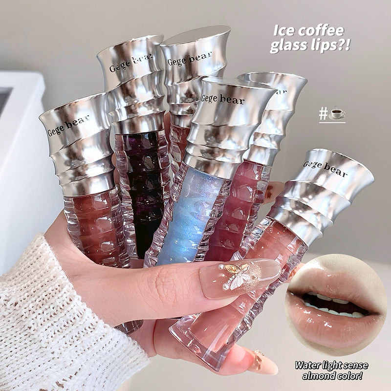 Hand holding multiple lip glosses with 'Gige bear' branding, close-up of a lip with a lip gloss, and text about ice coffee glass lips.
